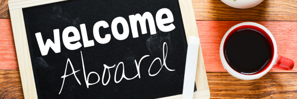 Welcome aboard sign with coffee